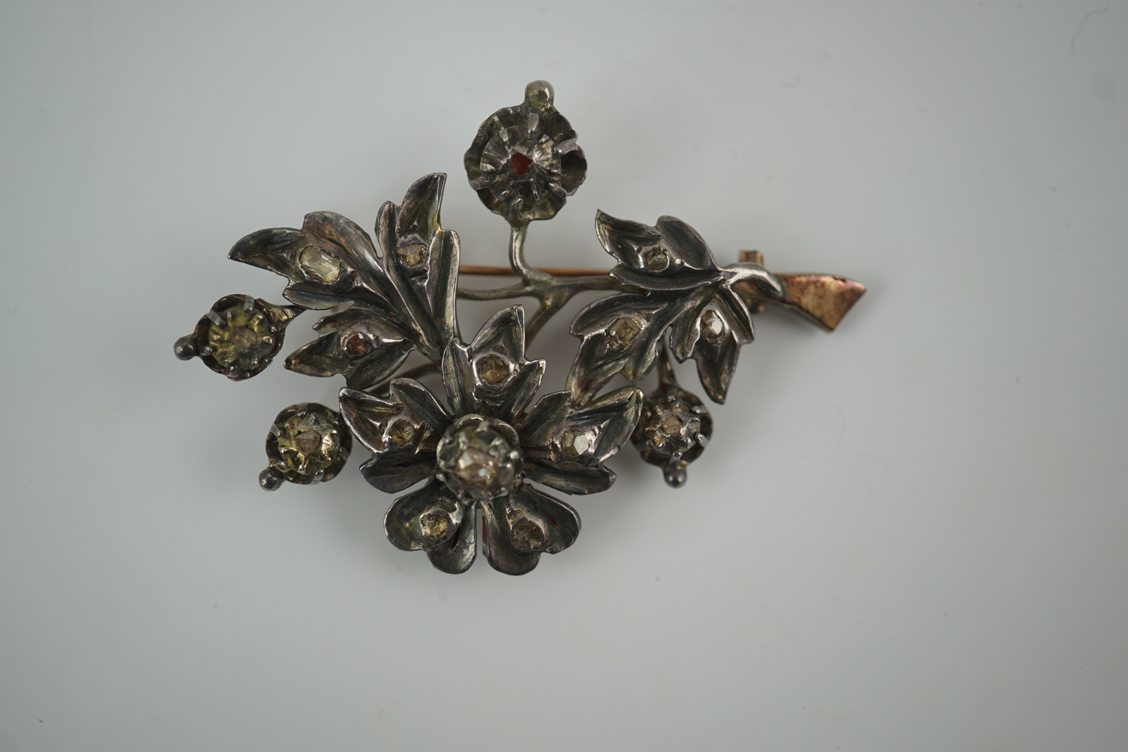 A Victorian gold overlaid silver and rose cut diamond set floral spray brooch